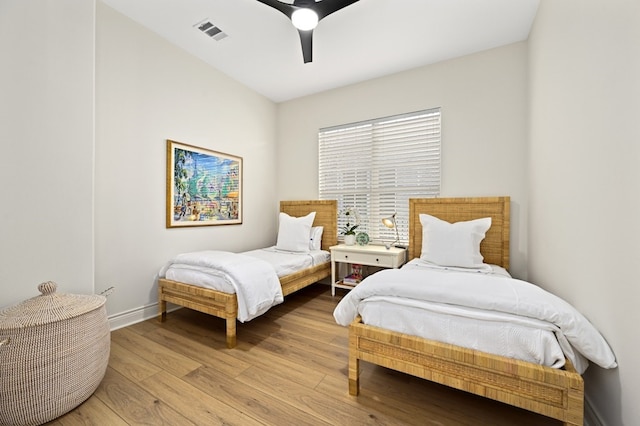 bedroom with light wood-type flooring and ceiling fan