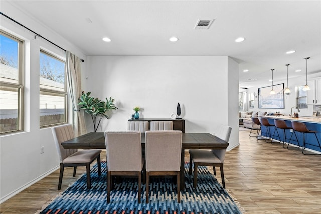 2004 Tasmanian Tiger Trce, Austin, TX 78728 - dining space featuring light wood-style floors, recessed lighting, and baseboards