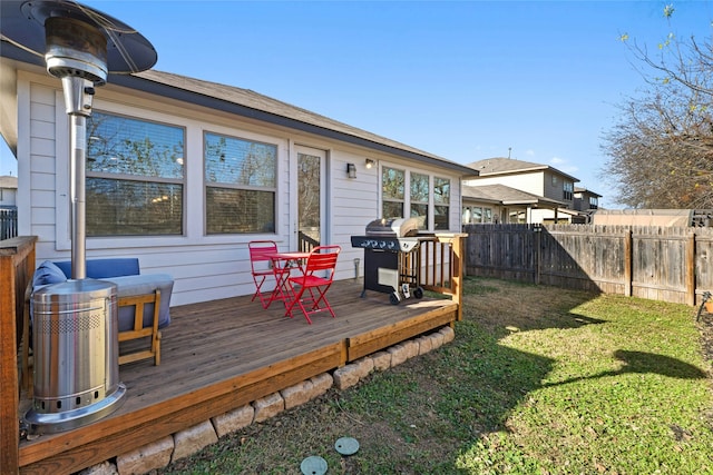 exterior space with a wooden deck and a yard