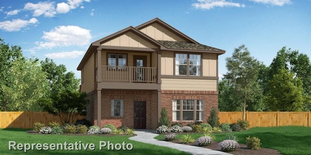 view of front of property with a balcony and a front yard