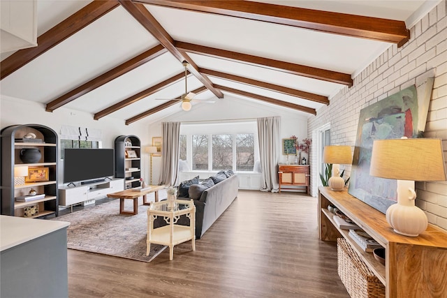 living room featuring dark hardwood / wood-style flooring, lofted ceiling with beams, and ceiling fan