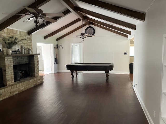 game room with lofted ceiling with beams, dark hardwood / wood-style flooring, pool table, ceiling fan, and a brick fireplace