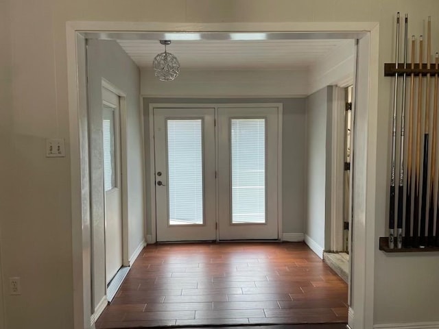 doorway to outside featuring dark hardwood / wood-style flooring and french doors