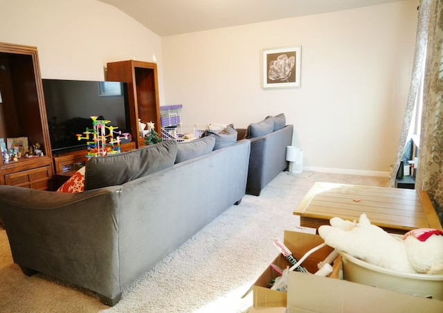 living room with lofted ceiling and light colored carpet