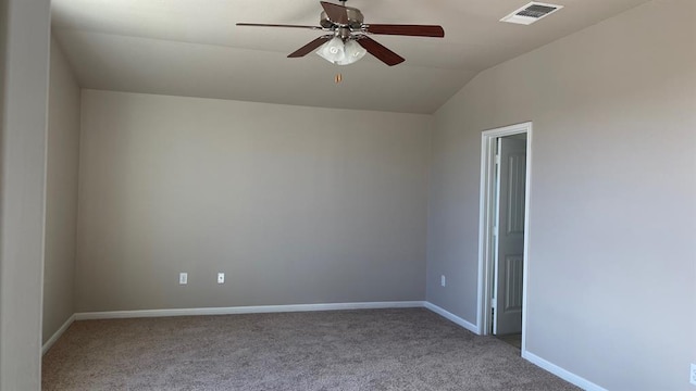 carpeted spare room with vaulted ceiling and ceiling fan