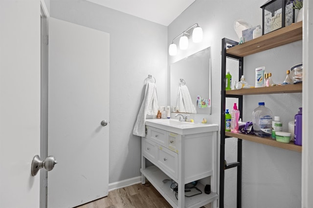 bathroom with vanity and hardwood / wood-style floors