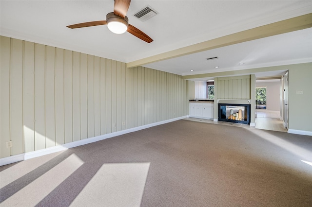 unfurnished living room with carpet floors and a multi sided fireplace