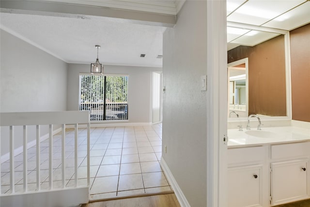 interior space with sink and light tile patterned floors