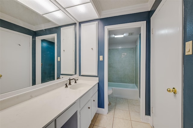 full bathroom featuring tile patterned floors, toilet, crown molding, vanity, and tiled shower / bath combo