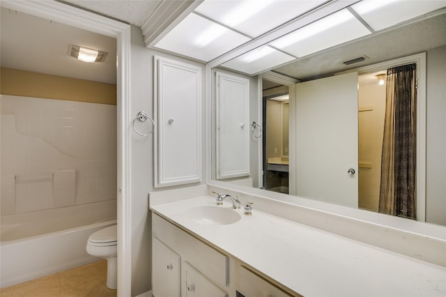 full bathroom featuring tile patterned flooring, vanity, shower / washtub combination, and toilet