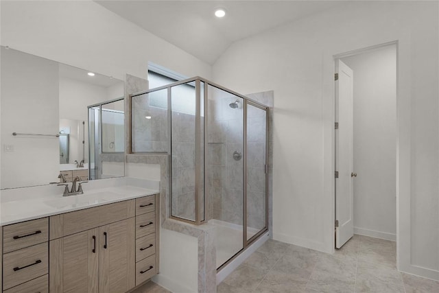 bathroom featuring baseboards, vanity, recessed lighting, and a stall shower