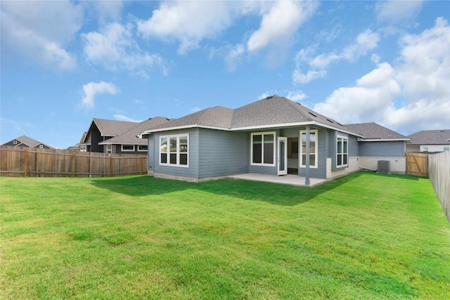 back of property featuring a fenced backyard, central air condition unit, a patio, and a lawn