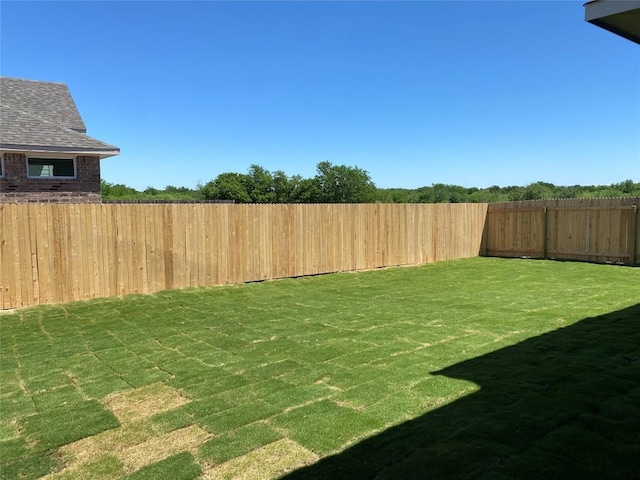 view of yard featuring a fenced backyard