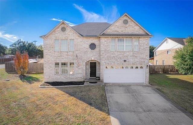 front of property with a garage and a front yard