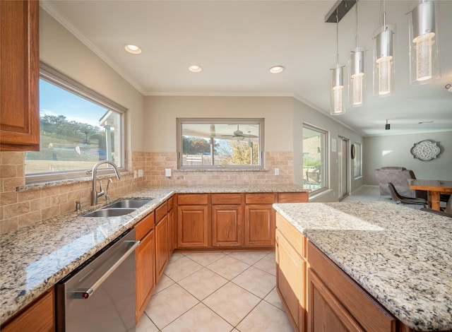 kitchen featuring sink, dishwasher, ornamental molding, decorative backsplash, and decorative light fixtures