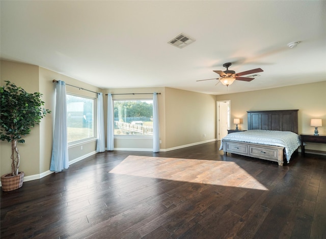 bedroom featuring dark hardwood / wood-style floors and ceiling fan