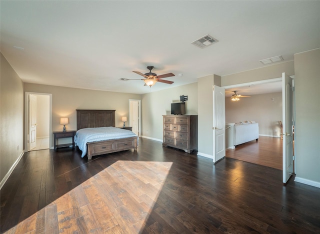 bedroom with dark hardwood / wood-style floors and ceiling fan