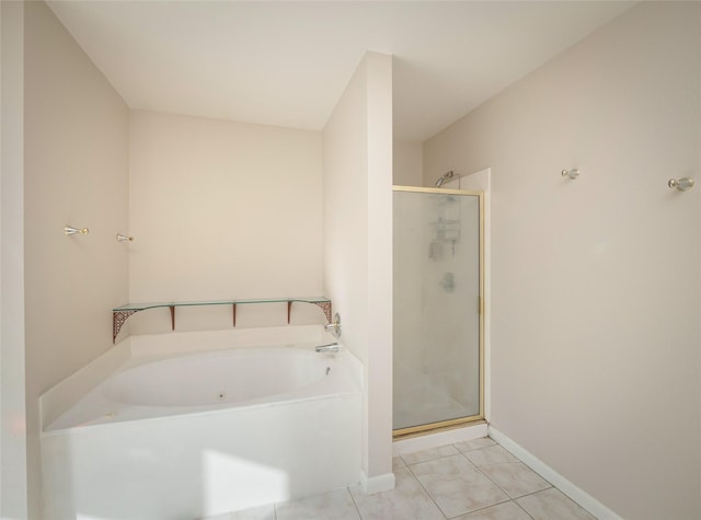 bathroom featuring tile patterned flooring and shower with separate bathtub