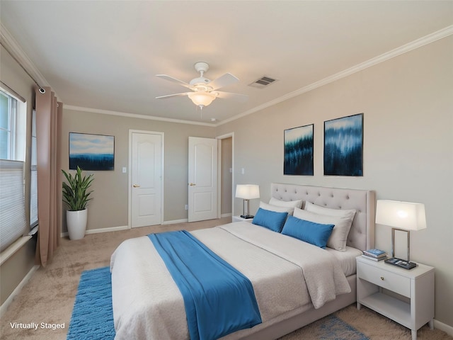 bedroom featuring ceiling fan, ornamental molding, and light carpet