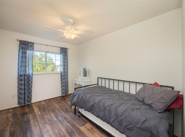 bedroom featuring ceiling fan and dark hardwood / wood-style floors