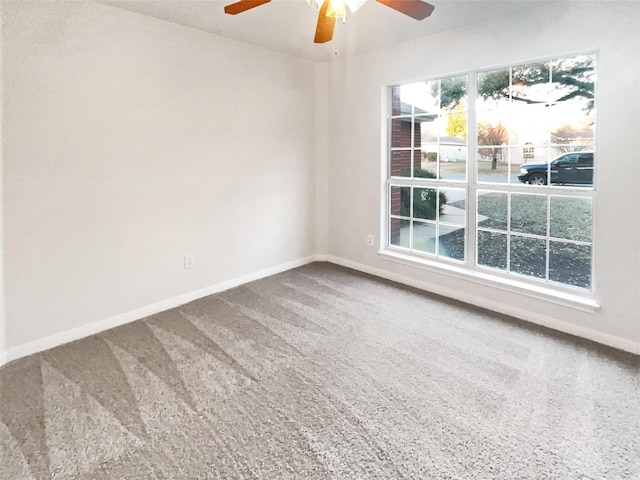 empty room featuring carpet and ceiling fan