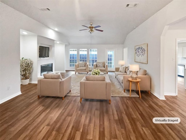 2005 Lark Ln, Taylor, TX 76574 - living area featuring ceiling fan, wood finished floors, a glass covered fireplace, recessed lighting, and lofted ceiling