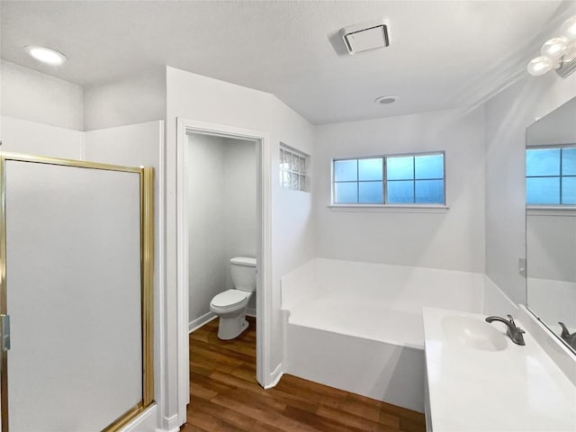 2005 Lark Ln, Taylor, TX 76574 - full bathroom with a bath, a shower stall, wood finished floors, and vanity