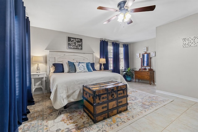 tiled bedroom featuring ceiling fan