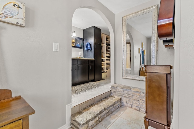 staircase with tile patterned floors