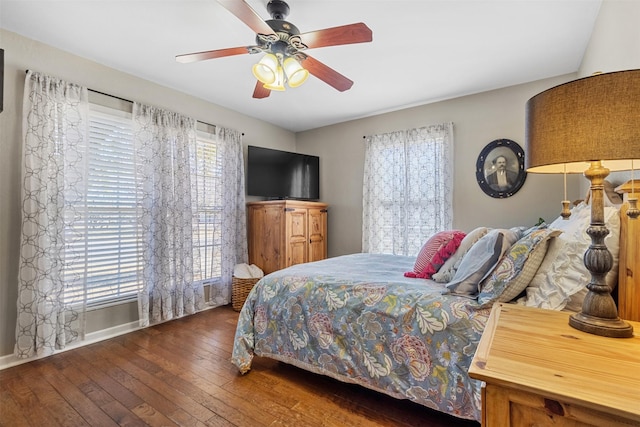 bedroom featuring ceiling fan and dark hardwood / wood-style flooring