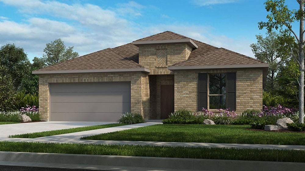 view of front of property featuring a garage and a front yard