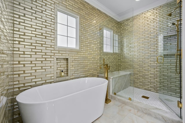 bathroom with crown molding, plus walk in shower, and tile walls