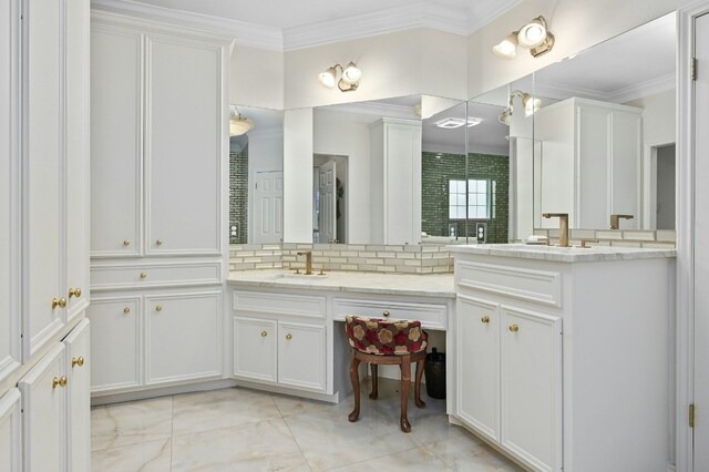 bathroom featuring vanity and crown molding