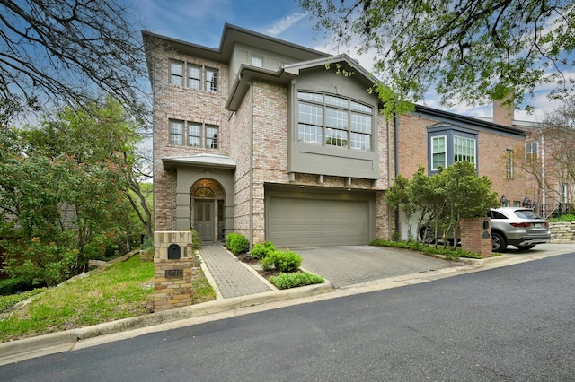 townhome / multi-family property featuring a garage