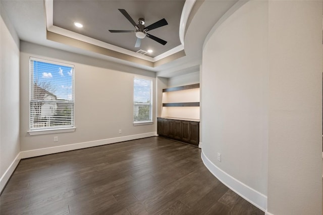 5801 Davenport Divide Rd, Austin, TX 78738 - unfurnished room with a ceiling fan, healthy amount of natural light, dark wood-style flooring, a raised ceiling, and ornamental molding