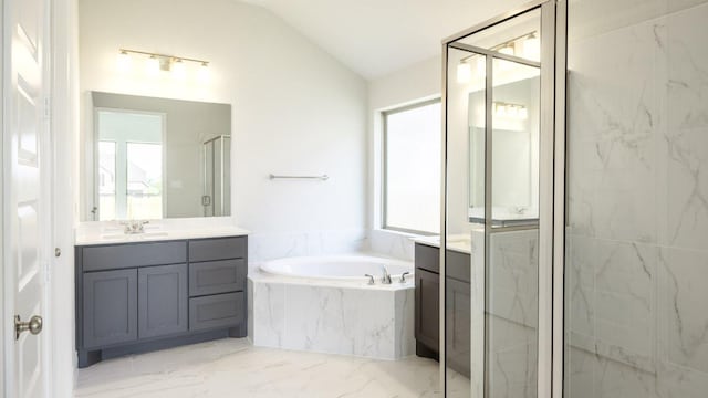 128 La Venta Loop, Liberty Hill, TX 78642 - bathroom with vanity, healthy amount of natural light, a garden tub, and lofted ceiling