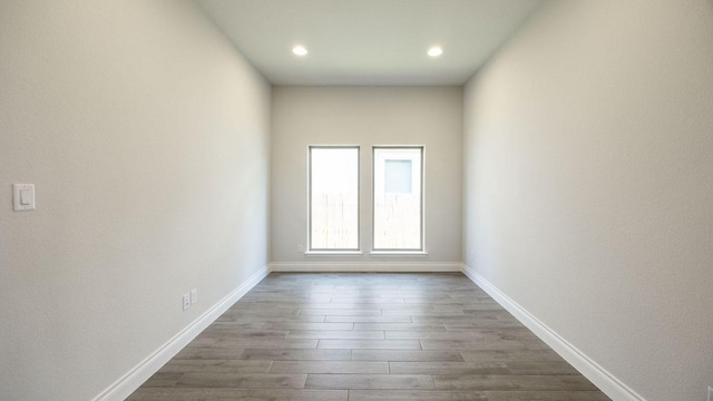 128 La Venta Loop, Liberty Hill, TX 78642 - unfurnished room featuring dark wood-style floors and recessed lighting