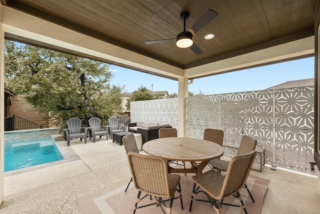 view of patio / terrace featuring ceiling fan and an outdoor living space