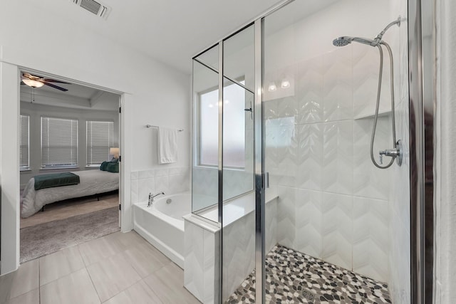 bathroom with ceiling fan, tile patterned floors, and plus walk in shower