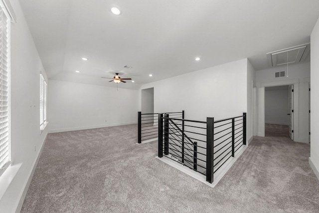 spare room featuring carpet floors and ceiling fan