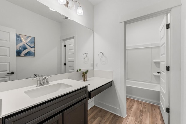 bathroom featuring hardwood / wood-style flooring and vanity