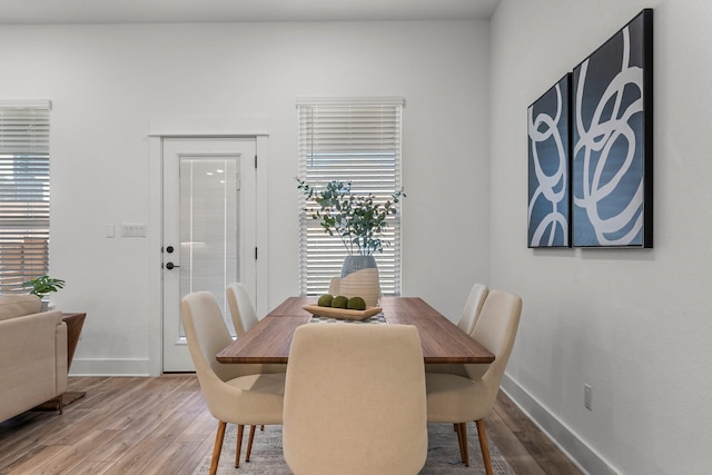 dining area with hardwood / wood-style floors