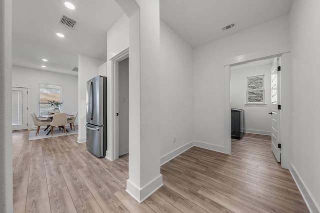 hallway featuring light hardwood / wood-style flooring