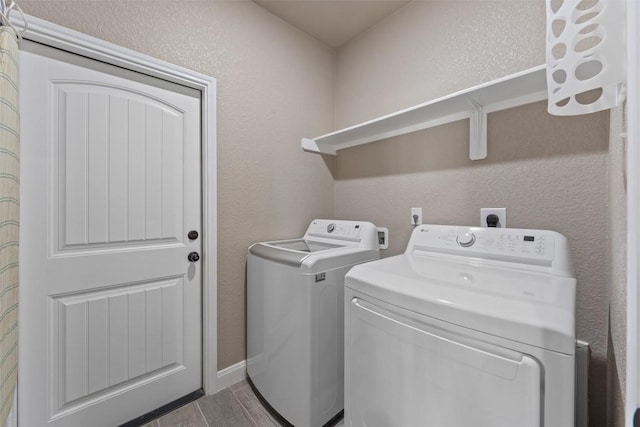 3608 Oglala Trl, Temple, TX 76502 - laundry area with separate washer and dryer, wood finished floors, and a textured wall