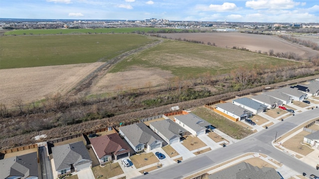 birds eye view of property with a rural view