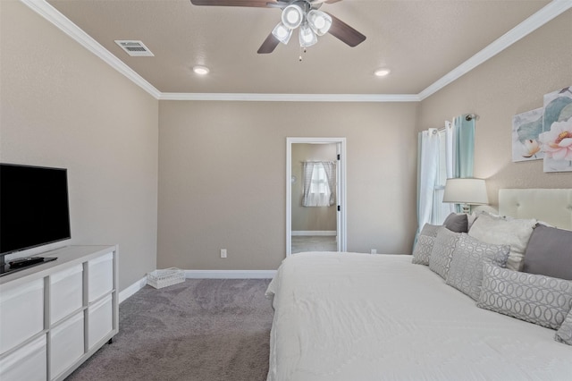 bedroom featuring ceiling fan, ornamental molding, carpet floors, and ensuite bath