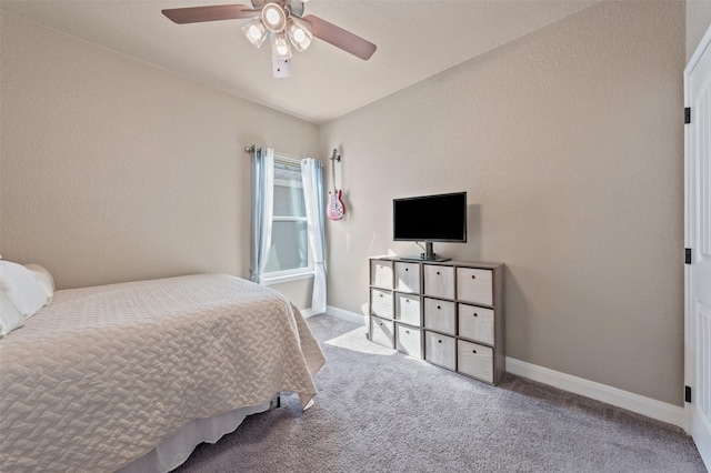 bedroom with light carpet and ceiling fan