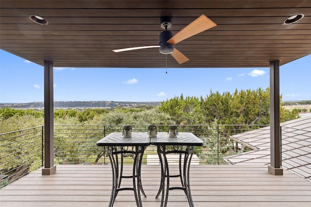 wooden terrace featuring ceiling fan