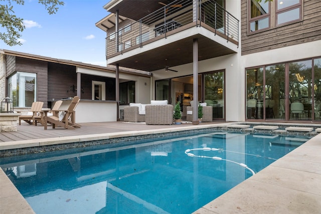 view of swimming pool featuring an in ground hot tub and an outdoor living space