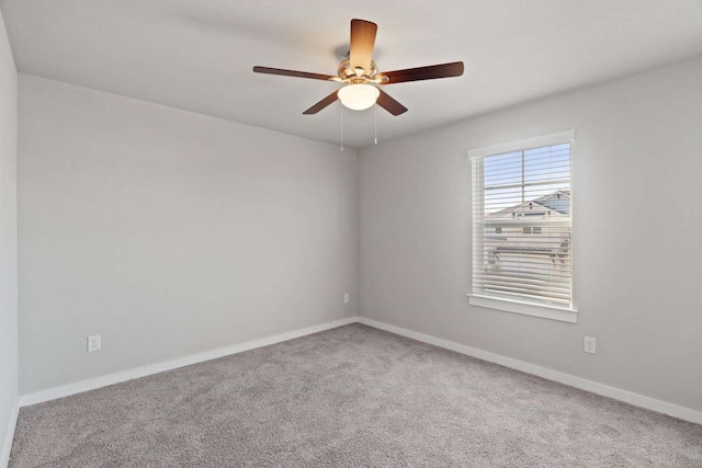 empty room featuring ceiling fan and carpet flooring